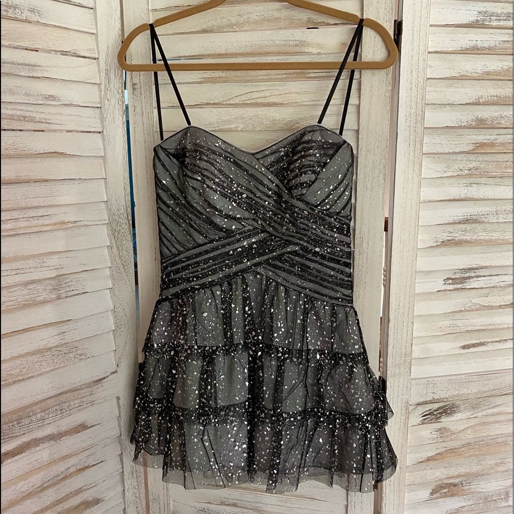 CUTE AND FUN black dress with metallic accents!